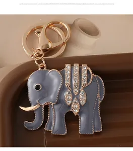 Detailed close-up of gray enamel elephant keychain with sparkling rhinestones and gold plating