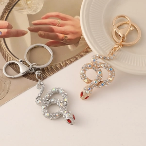 Elegant gold and silver snake keychains with sparkling rhinestones for bags and keys