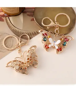 Detailed close-up of butterfly keychains with colorful rhinestones and gold alloy lobster clasp