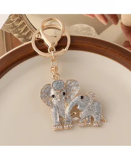 Detail of elephant keychain with silver glitter, white rhinestones, and lobster clasp