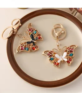 Detail of golden butterfly keychain with colorful rhinestones and lobster clasp