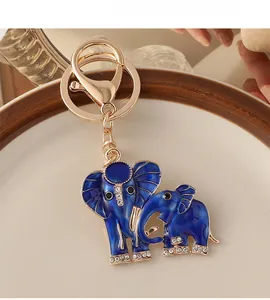Detail of blue enamel elephant keychain with gold alloy finish and sparkling rhinestones