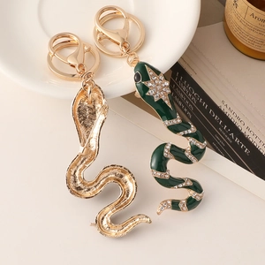 Elegant snake-shaped enameled keychain with sparkling rhinestones and gold-tone hardware