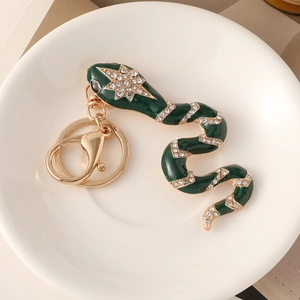 Green enamel snake keychain with sparkling rhinestones and golden hardware for bags