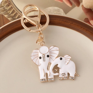 Golden elephant mother and child keychain with white enamel and sparkling rhinestones