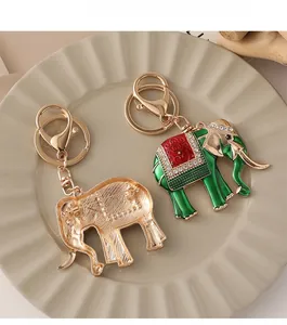 Detailed view of green enamel elephant keychain with sparkling crystal rhinestones inlay
