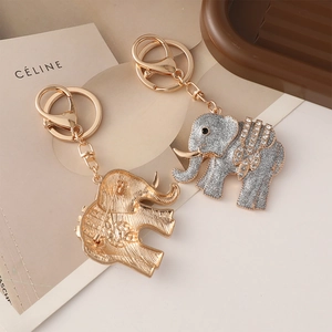 Elephant charm keychain with sparkling rhinestones and brooch pin functionality