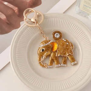 Porte-clés éléphant doré scintillant avec strass blancs et fermoir mousqueton en métal