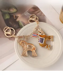 Detailed view of Thai elephant keychains with colorful glitter and national flag