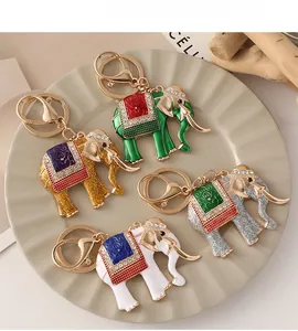 Detailed close-up of elephant keychains with colorful enamel art and sparkling rhinestones