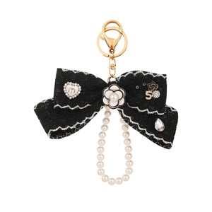 Elegant black lace bow keychain with camellia flower, pearl chain and gold lobster clasp