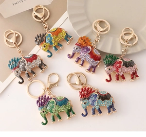 Detail of colorful rhinestone elephant keychains with fine enamel and gold-tone finish