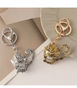 Detailed close-up of Monkey King keychains with white rhinestones in gold and silver finish