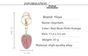 Detailed view of pink rhinestone strawberry keychain with gold-tone alloy ring and measurements