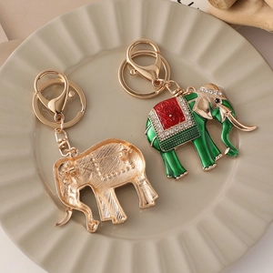 Green crystal elephant keychain and brooch dual-use accessory with golden plating