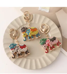 Detailed macro of creative elephant keychains featuring colorful enamel and rhinestones