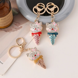 Cartoon kitten ice cream crystal keychains in red blue and gold with rhinestones