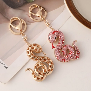Porte-clés serpent du zodiaque en dessin animé avec strass en finitions or et rose