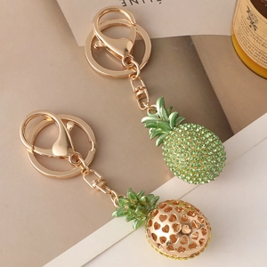 Sparkling pineapple keychain set with green rhinestones and hollow heart metal designs