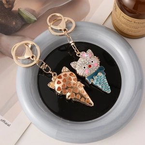 Cartoon ice cream cat keychain with rhinestones and lobster clasp on ceramic plate