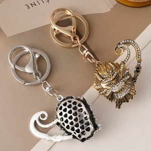 Exquisite Sun Wukong Monkey King keychain set in gold and silver with sparkling rhinestones