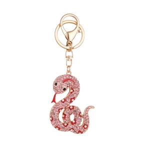 Porte-clés serpent doré avec strass roses et détails de fleurs en émail rouge