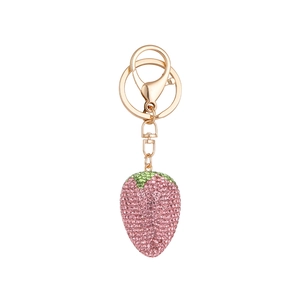 Sparkling pink rhinestone strawberry keychain with gold lobster clasp and green leaf detail