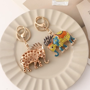Southeast Asian elephant keychain with sparkling rhinestones and golden heart patterns