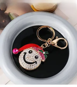 Detail of creative Christmas snowman hat keychain with inlaid crystals and lobster clasp