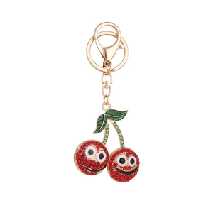 Creative rhinestone double cherry keychain with red smiling face and golden metal clasp
