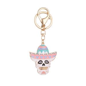 Porte-clés tête de mort d'Halloween avec sombrero coloré et strass sur fond blanc épuré