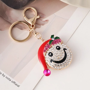 Creative Christmas snowman hat keychain with rhinestones and lobster clasp on white background