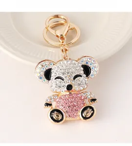 Close-up of koala keychain with sparkling rhinestones and golden metal lobster clasp
