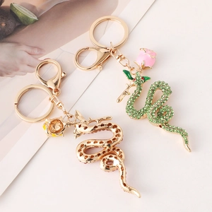Exquisite snake and rose metal keychains with green rhinestones and golden plating