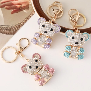 Sparkling crystal teddy bear keychain set in pink, purple and blue with gold hardware