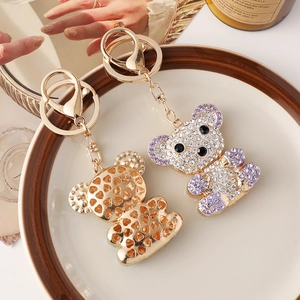 Sparkling rhinestone bear keychain with gold hollow heart pendant and lobster clasp