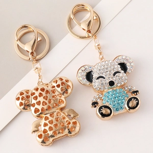 Gold-plated koala keychains with hollow heart design and blue crystal rhinestones
