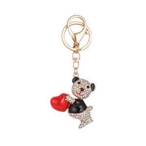 Llavero de oso de peluche con diamantes de imitación blancos y amuleto de corazón rojo