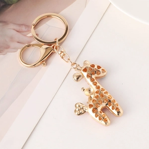 Golden hollow giraffe keychain with heart patterns and lobster clasp for bag decoration