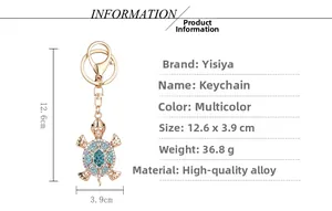 Detailed close-up of a golden turtle keychain with colorful gradient rhinestones and lobster clasp