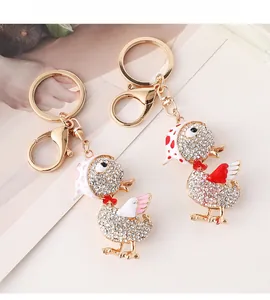 Détails de porte-clés canard sertis de strass avec foulards à pois et nœuds papillons