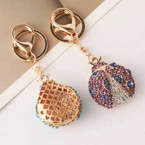 Sparkling crystal beetle keychain with gold-plated metal and detailed rhinestone inlay