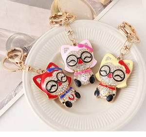 Détails de porte-clés renard étincelants en strass de couleurs rouge, rose et jaune
