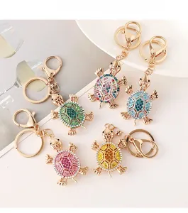 Detailed view of colorful turtle keychains with crystal rhinestones and golden alloy