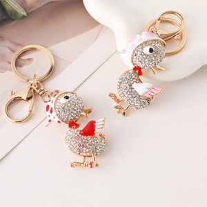 Porte-clés canard mignon serti de strass et foulards à pois sur alliage doré brillant
