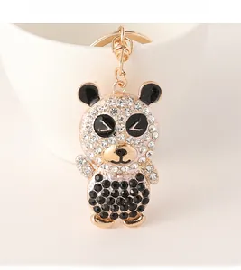 Detail shot of a sparkling rhinestone panda keychain with a gold-tone alloy base