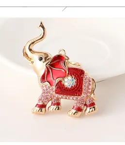 Detail of crystal-studded elephant keychain with red enamel and golden alloy finish