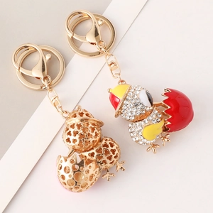 Kreativer Schlüsselanhänger mit Strass-Küken-Ei, Gold-Hohlraum und Emaille-Finish