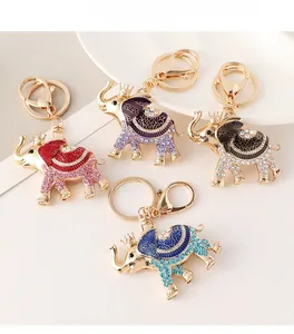 Close-up of elephant keychains with sparkling rhinestones and colorful enamel patterns