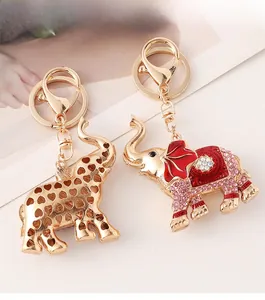 Detail of elephant keychain with red enamel work and heart-shaped hollow design back
